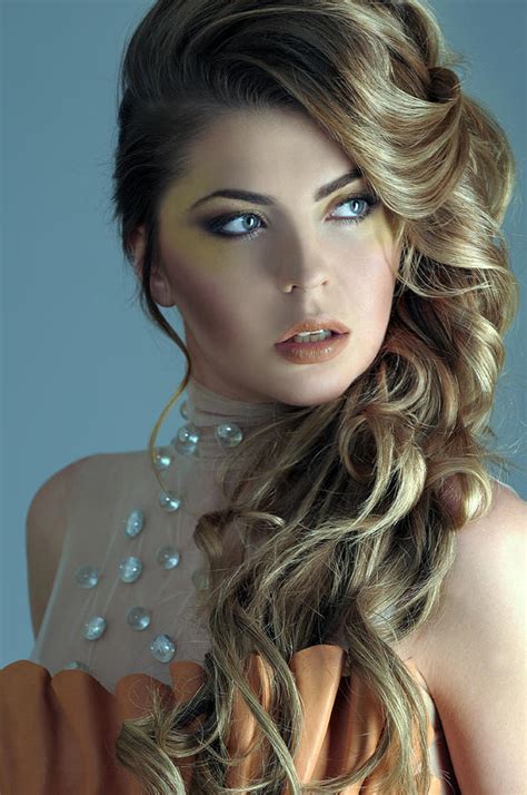 Beautiful female model with makeup with jewelry on her head. . Beautiful female models photos
